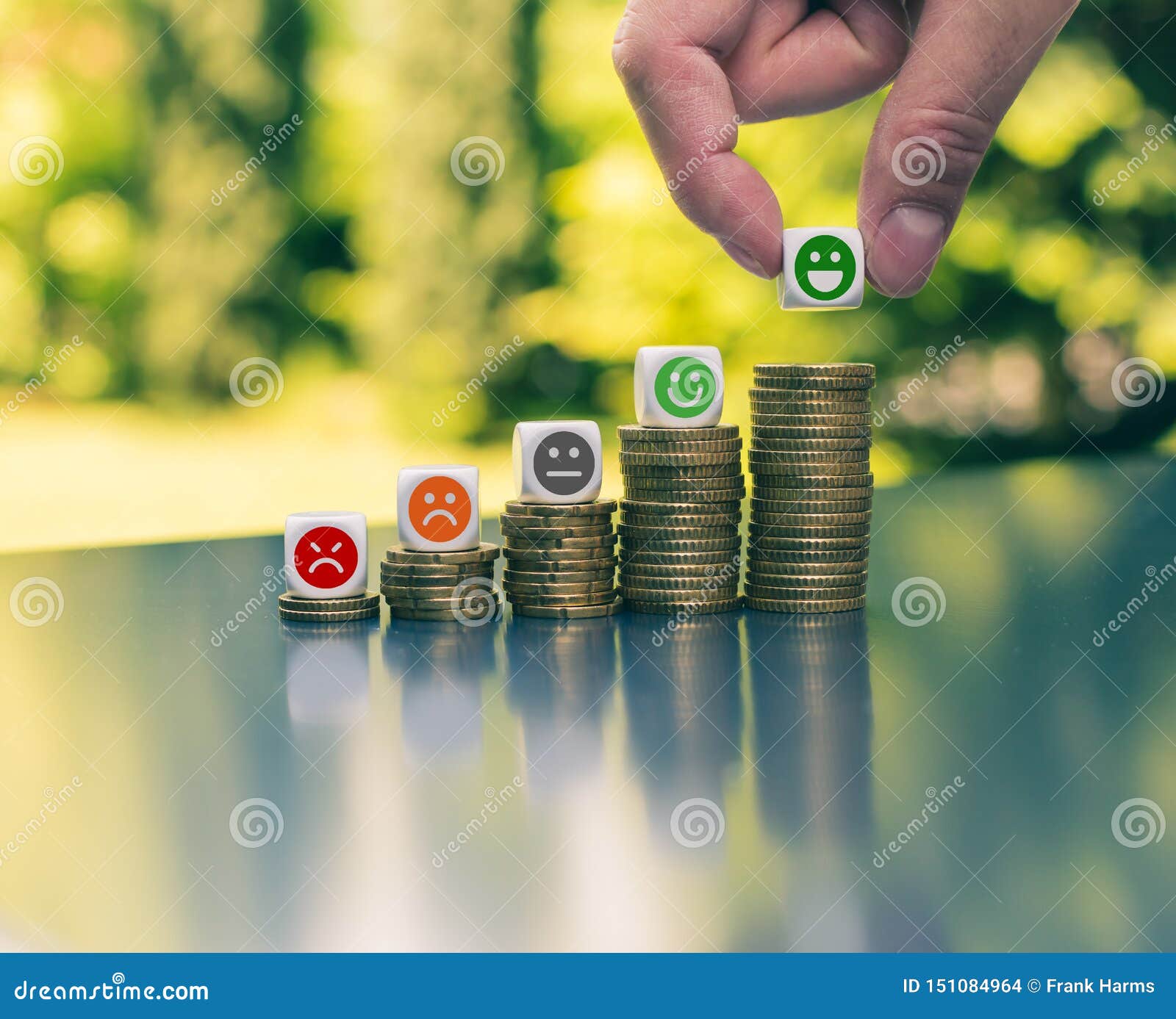 Emojis on Increasing High Stacks of Coins Stock Photo Image of hand