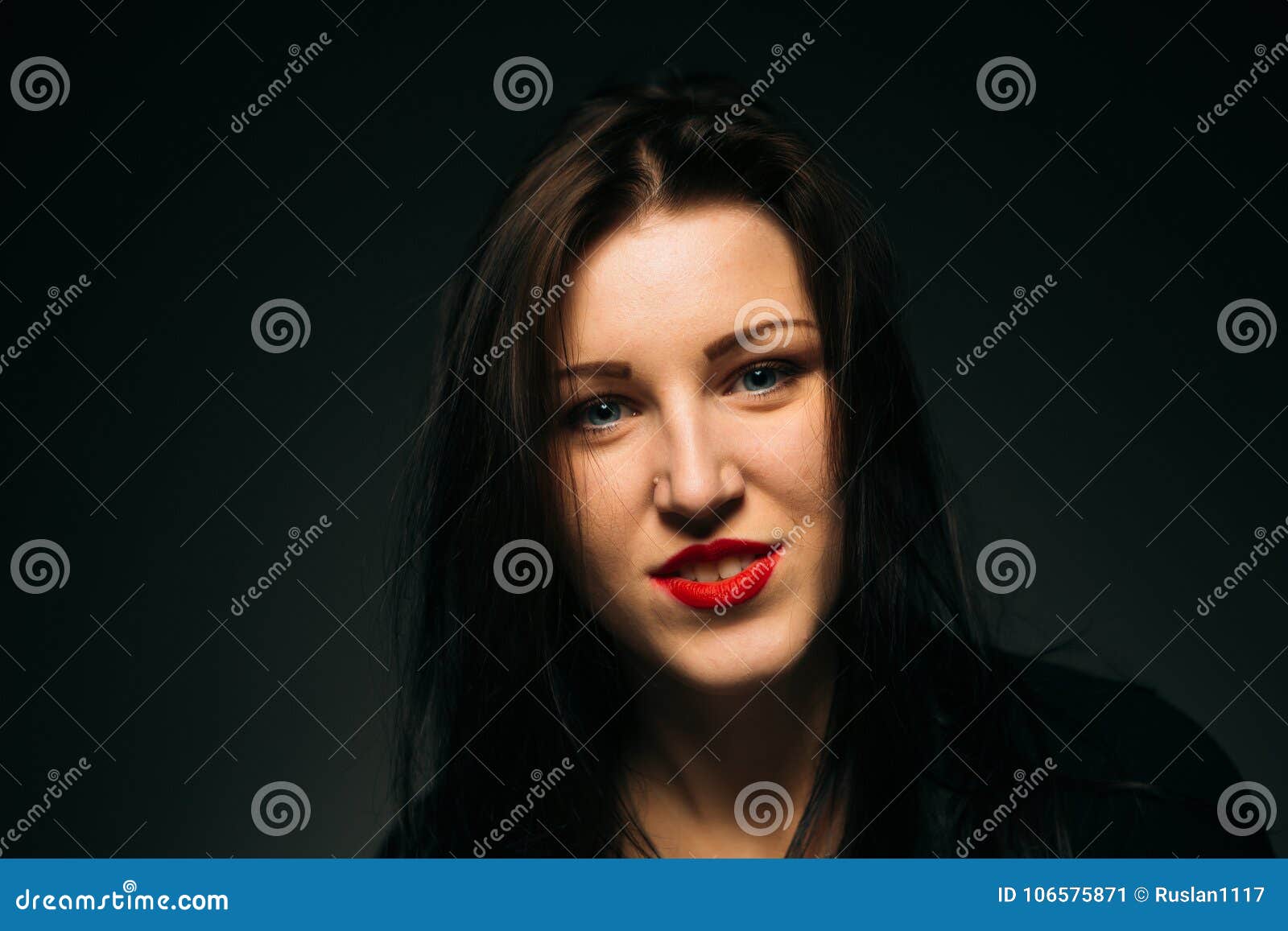 Emotional Girl Smiling on a Dark Background Stock Image - Image of