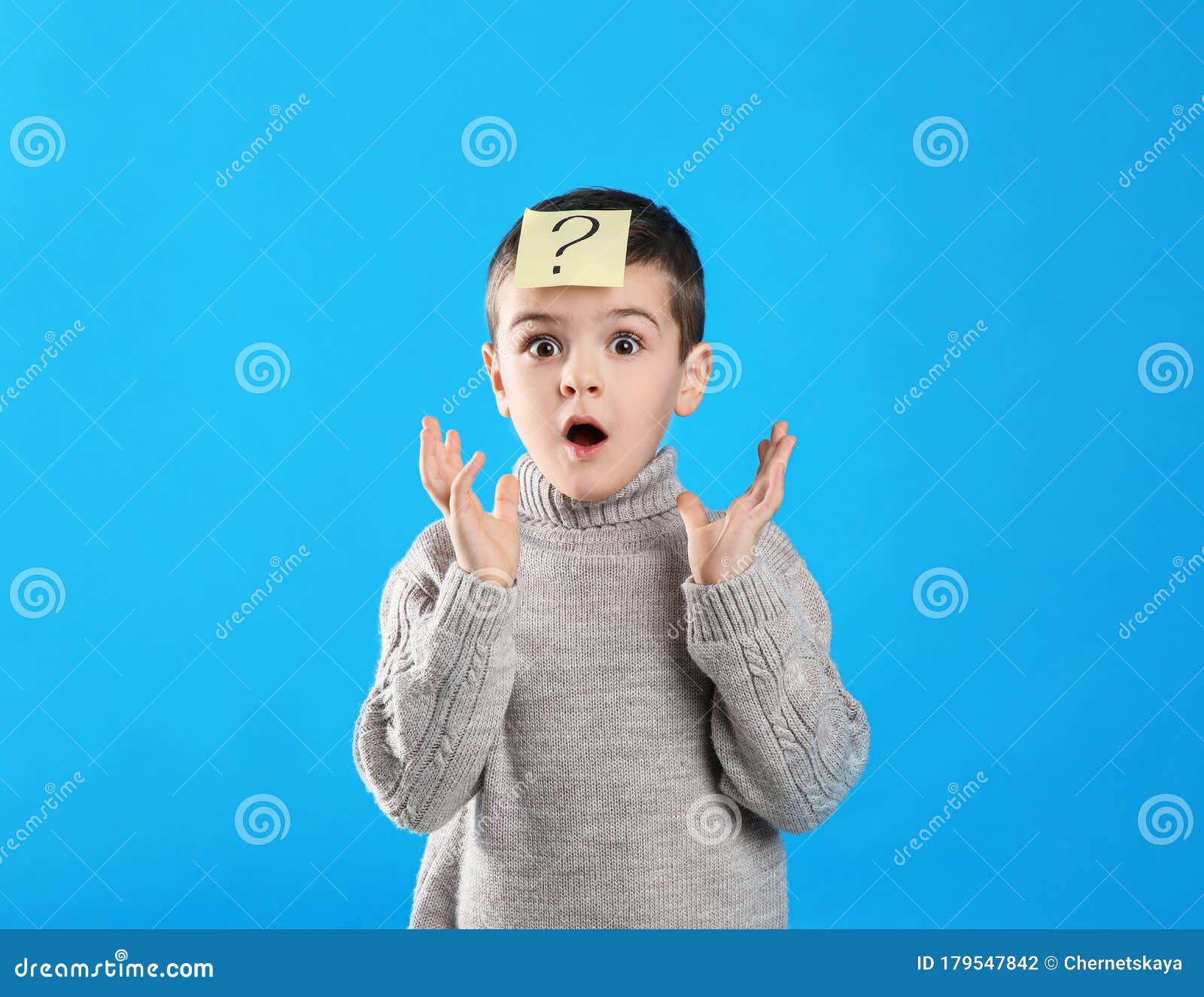 Emotional Little Boy with Question Mark on Blue Background Stock Photo ...