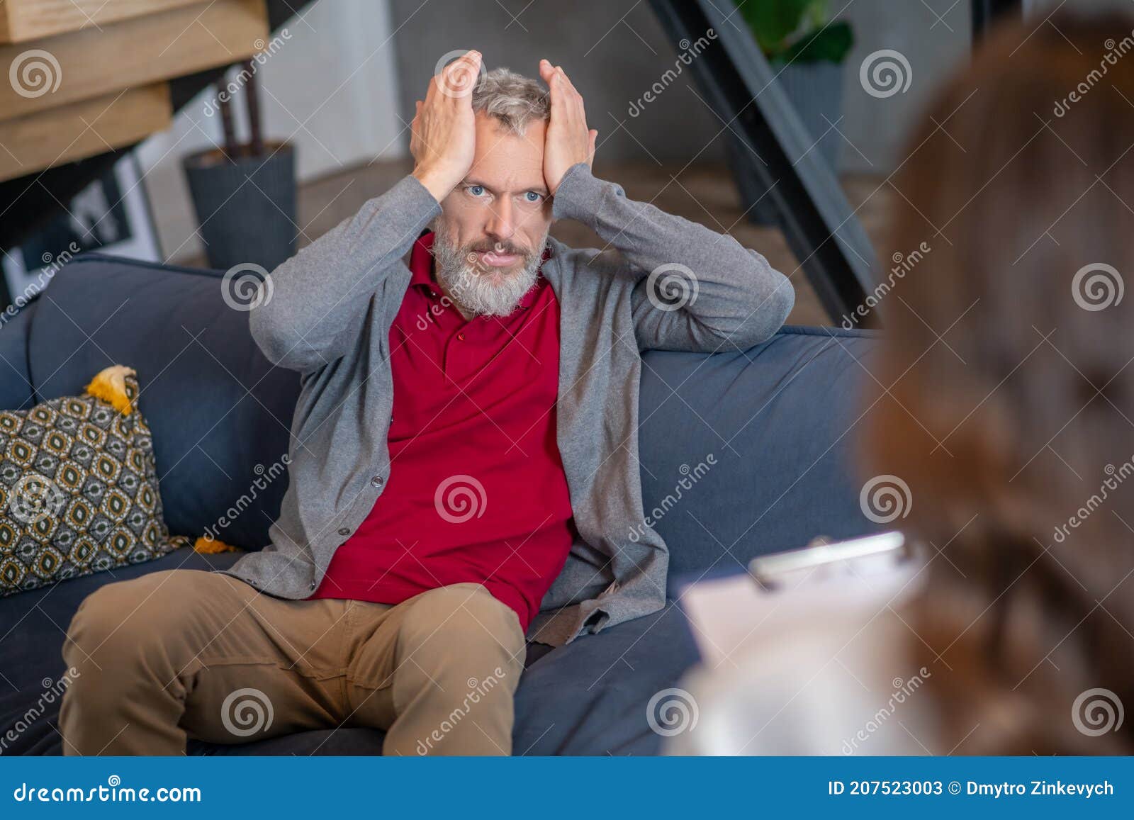 emotional man talking to a therapist about his troubles