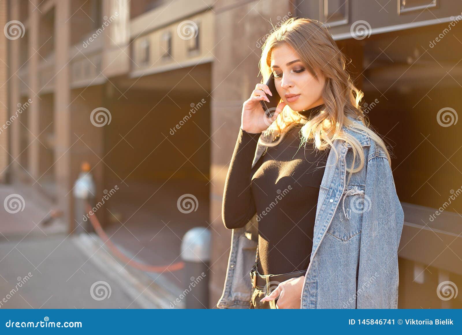 Emotional Stylish Portrait Of A Young Blond Woman On A Cityscape Background Close Up In The 