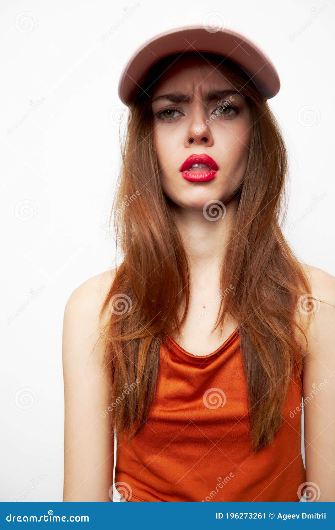 Emotional Woman in a Cap with an Open Mouth, a Daring Look Attractive ...