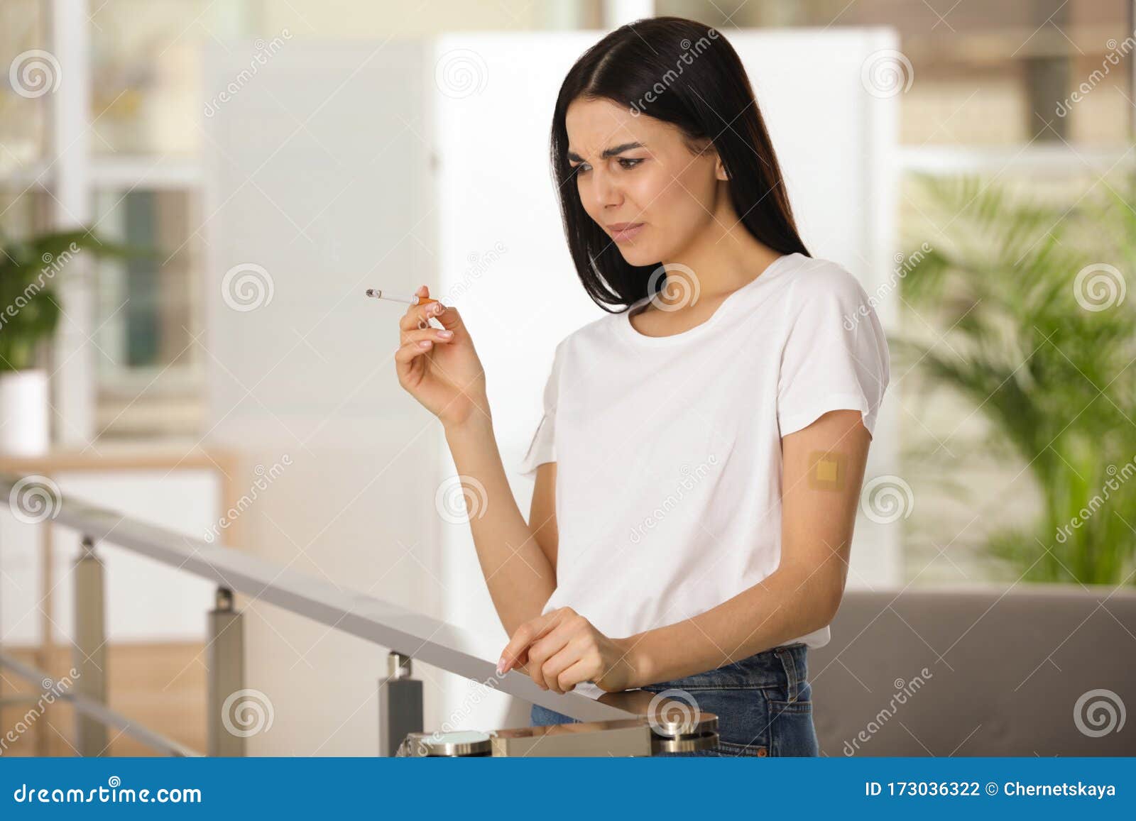 Emotional Young Woman With Nicotine Patch And Cigarette Stoc