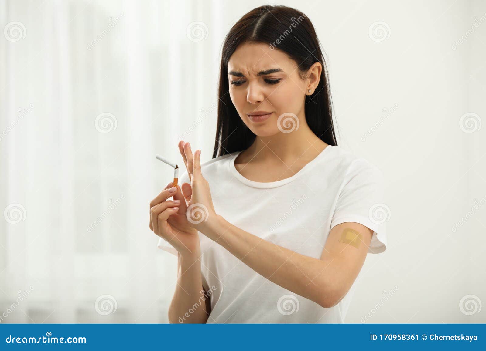 Emotional Young Woman With Nicotine Patch And Cigarette Stock Image