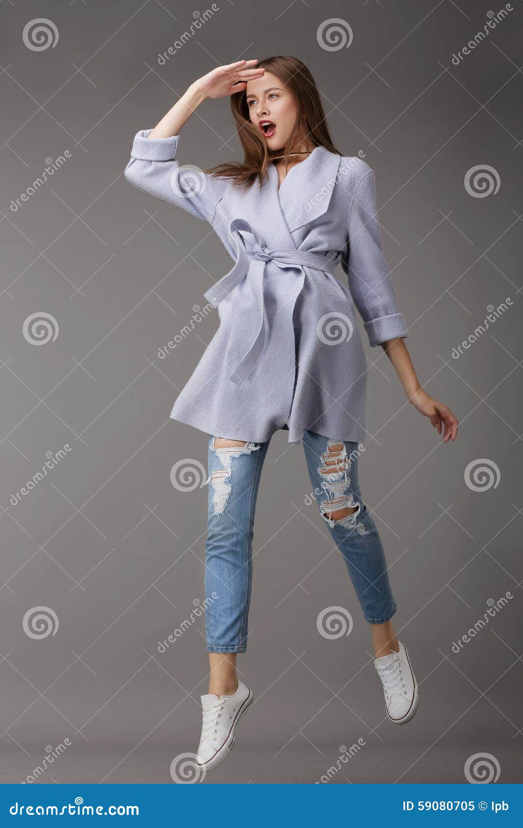 emotional young woman in outer garments