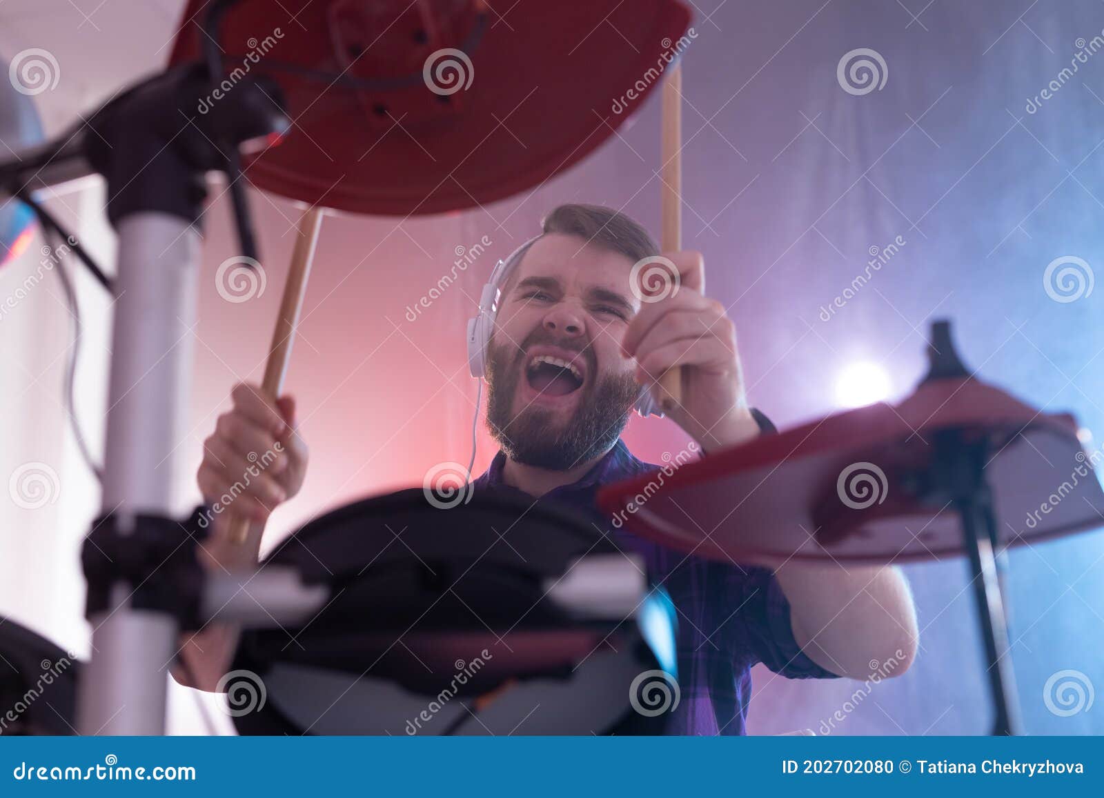 Emotions, Drums, Hobby and People Concept - Rock Musician Playing the ...