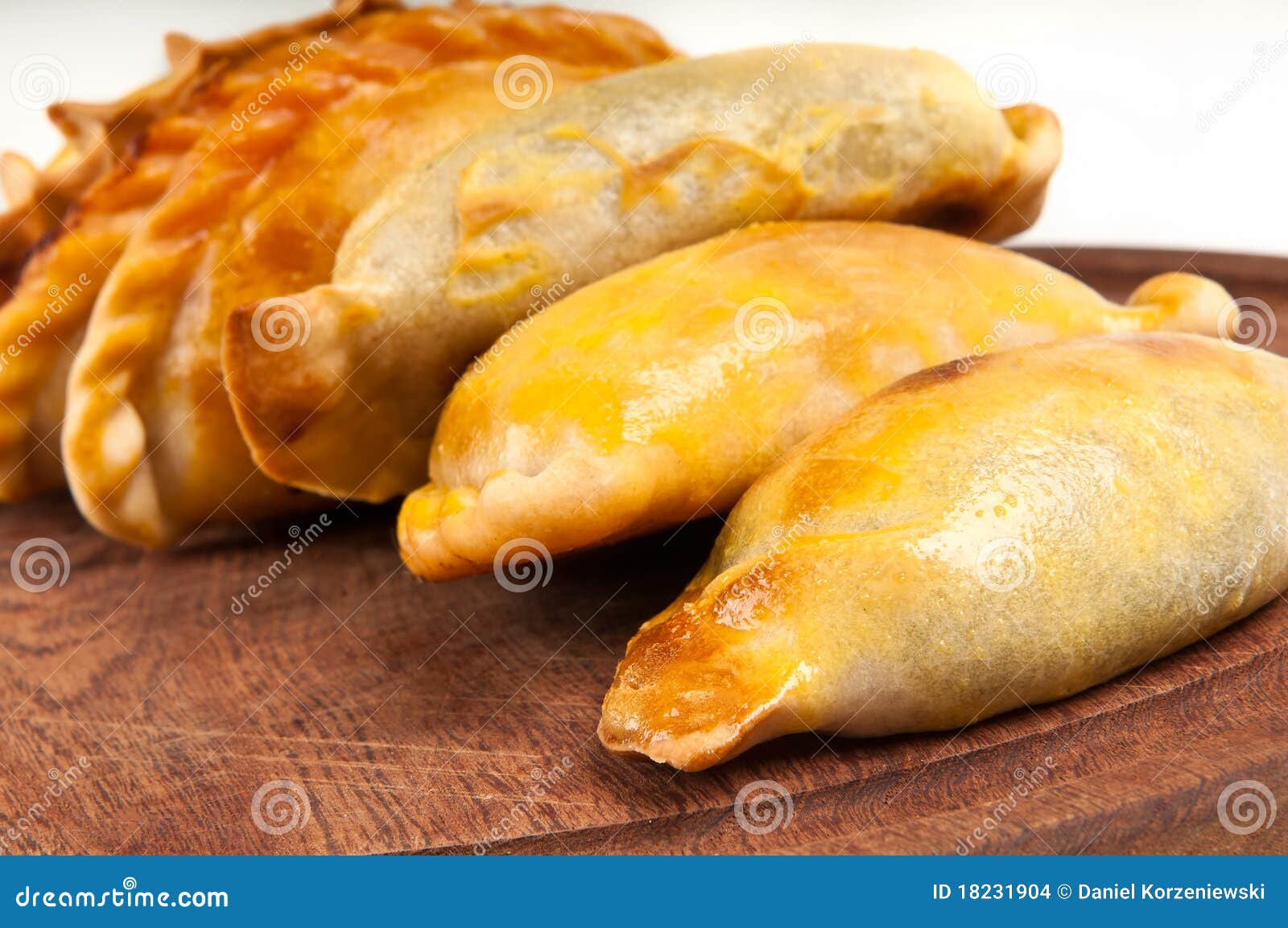empanada close up over wooden table.