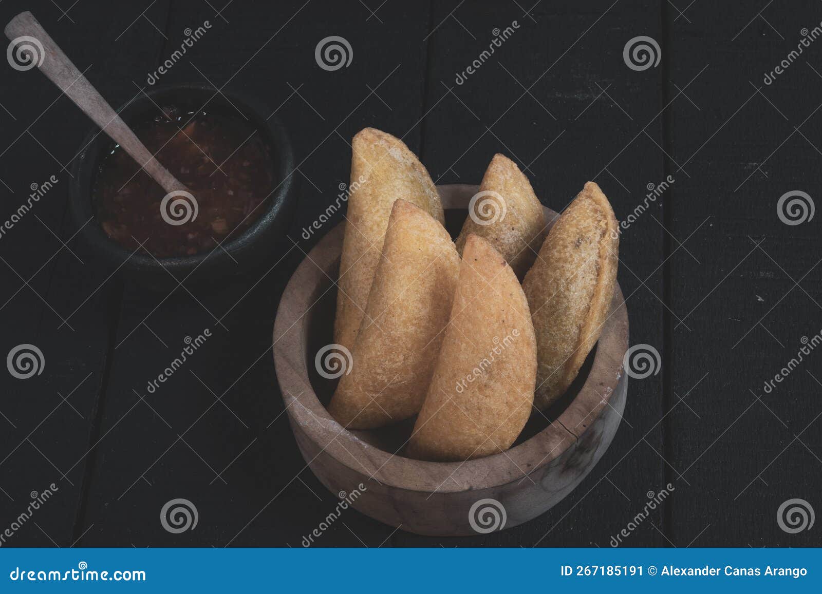 Delicious Traditional Colombian Empanadas with Spicy Sauce Stock Image