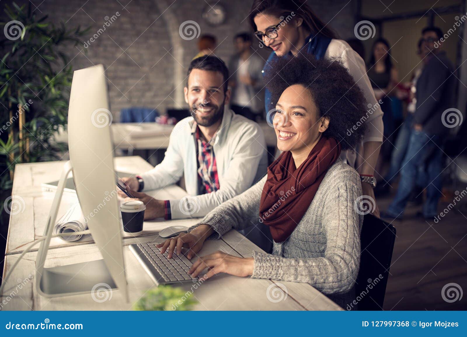 employed woman at computer in office