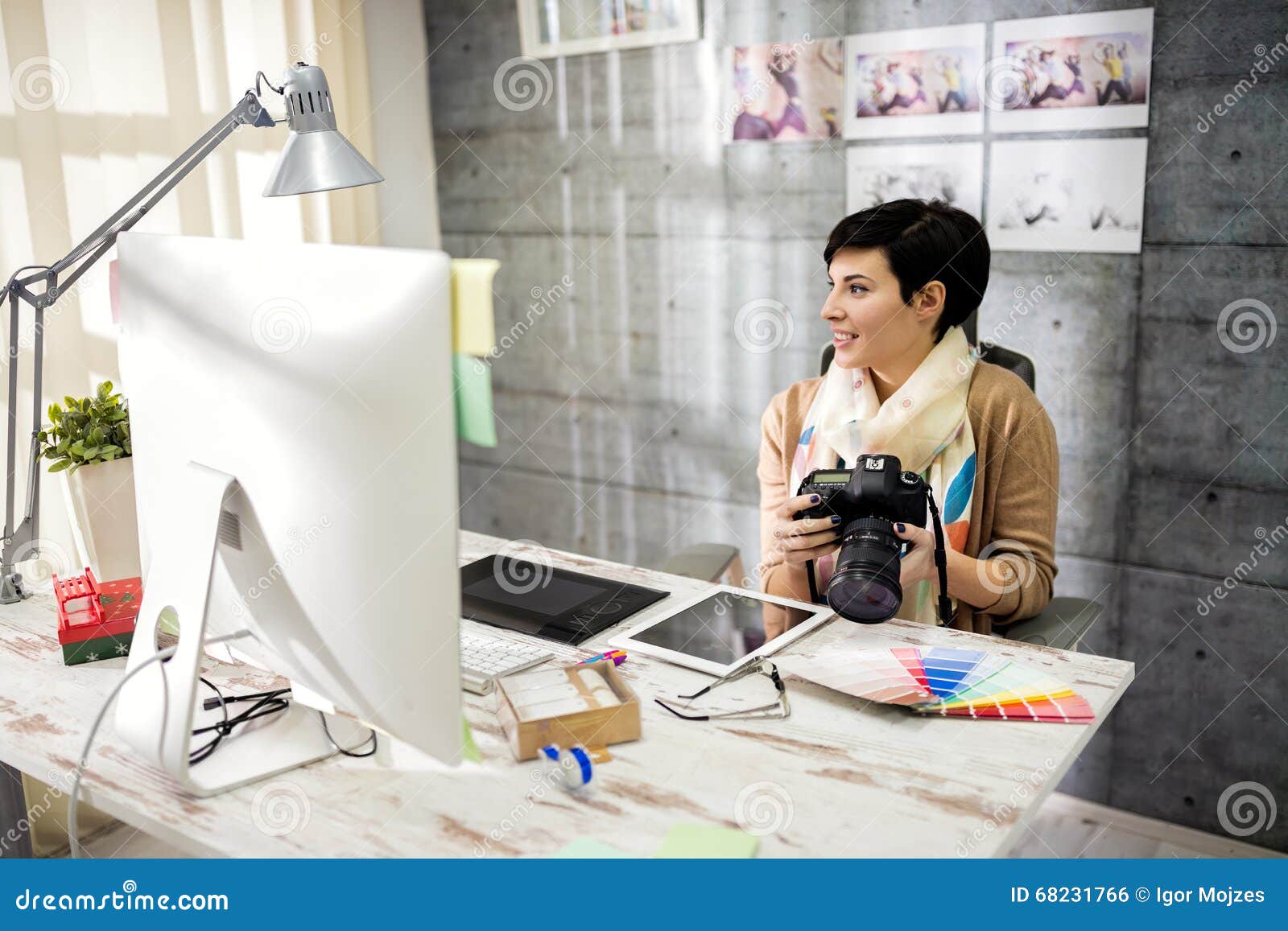 employed woman working in photo studio