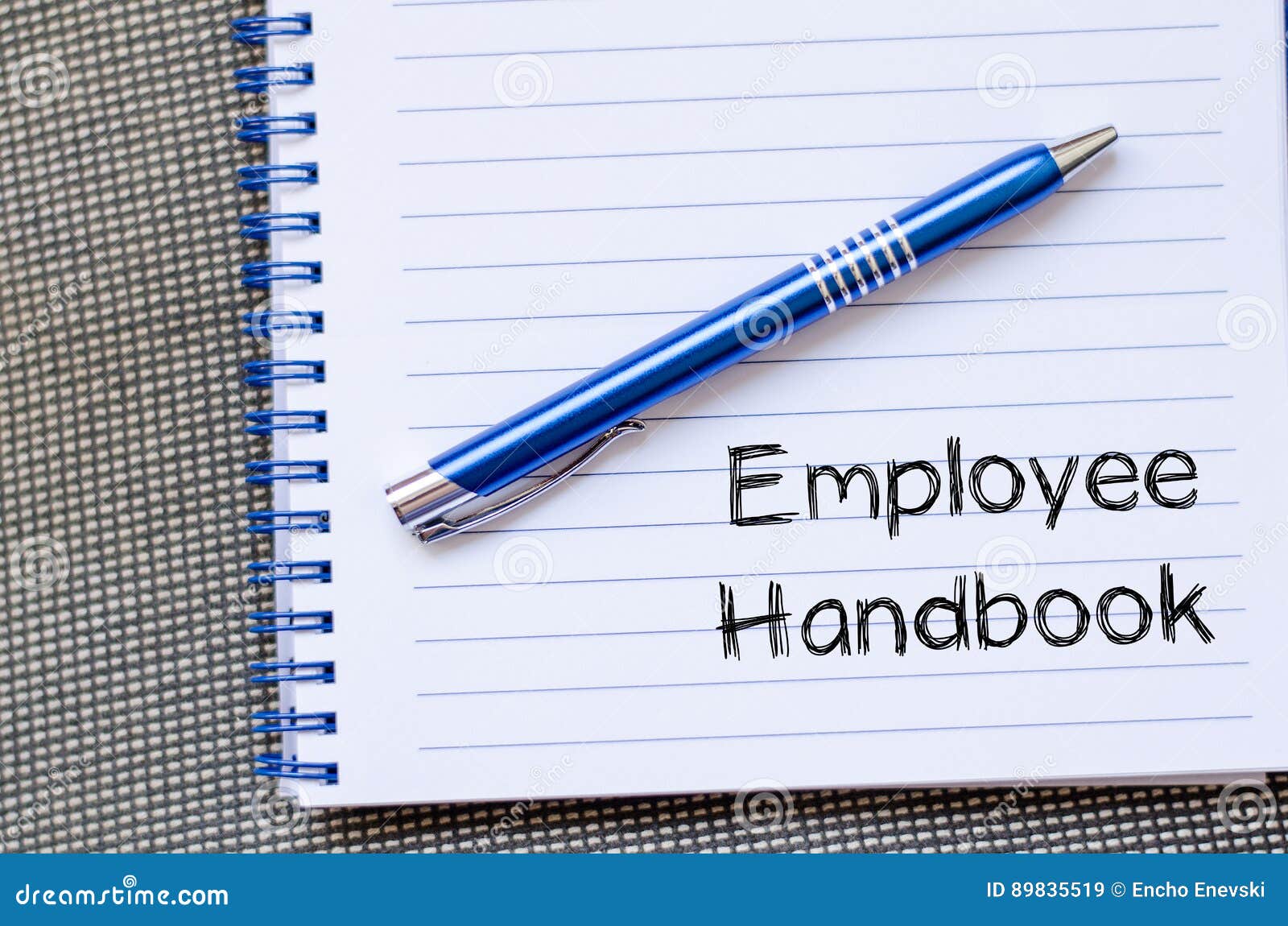 employee handbook text concept on notebook