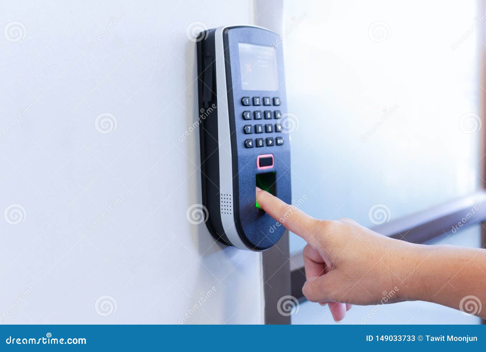 Employee Scanning Fingerprint To Record Working Time Stock Image