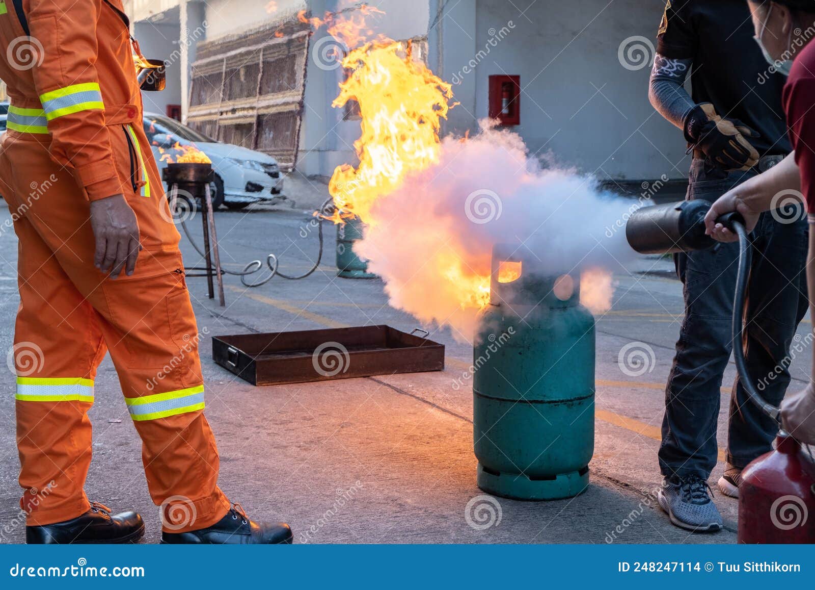 Employees Firefighting Training,Extinguish a Fire Stock Photo Image