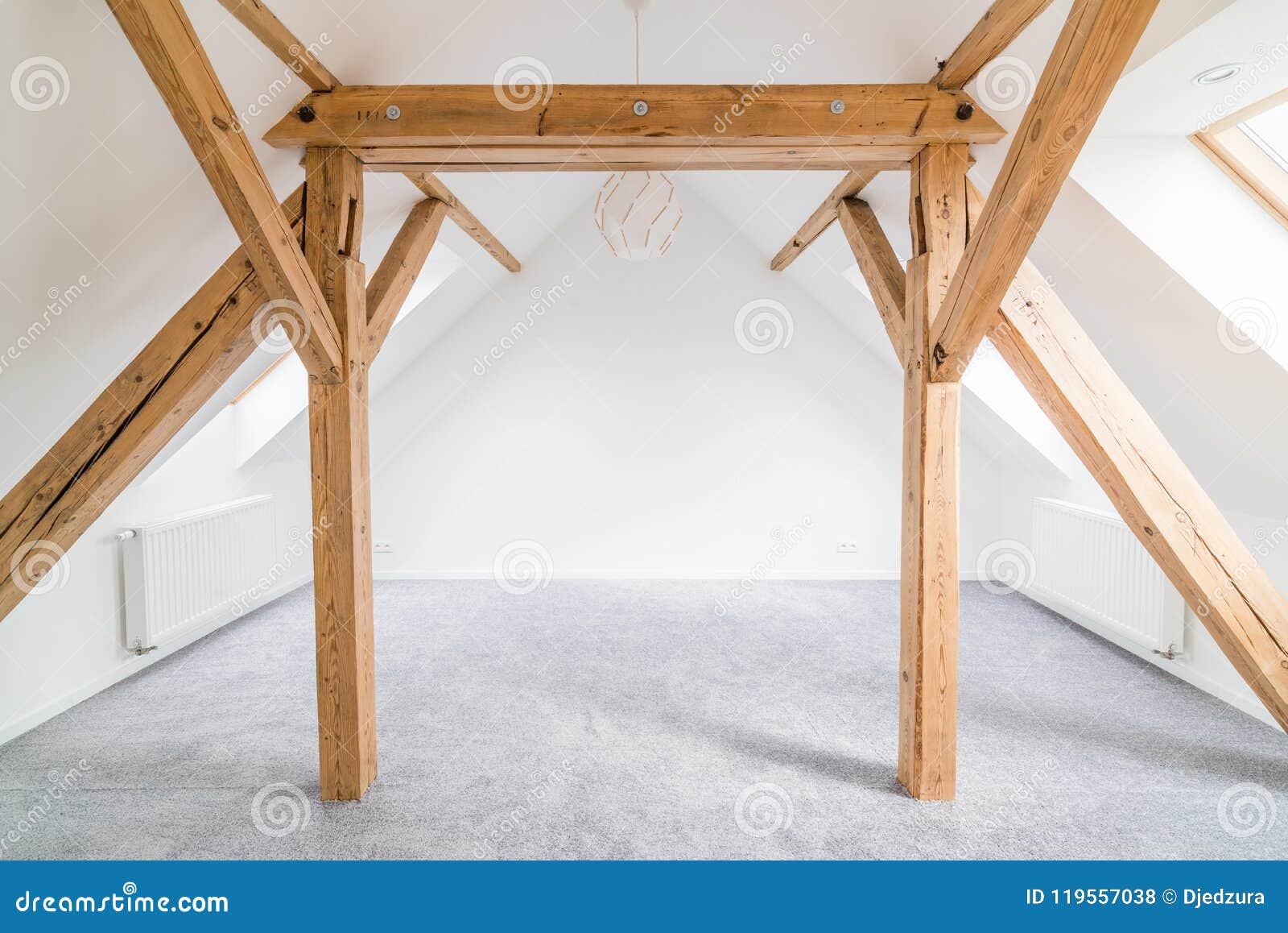 Empty Attic Room With Wooden Ceiling Beams Stock Photo