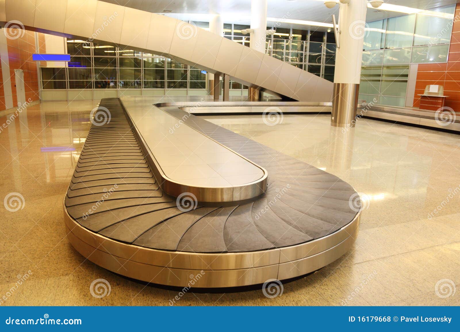 empty baggage carousel in airport hall