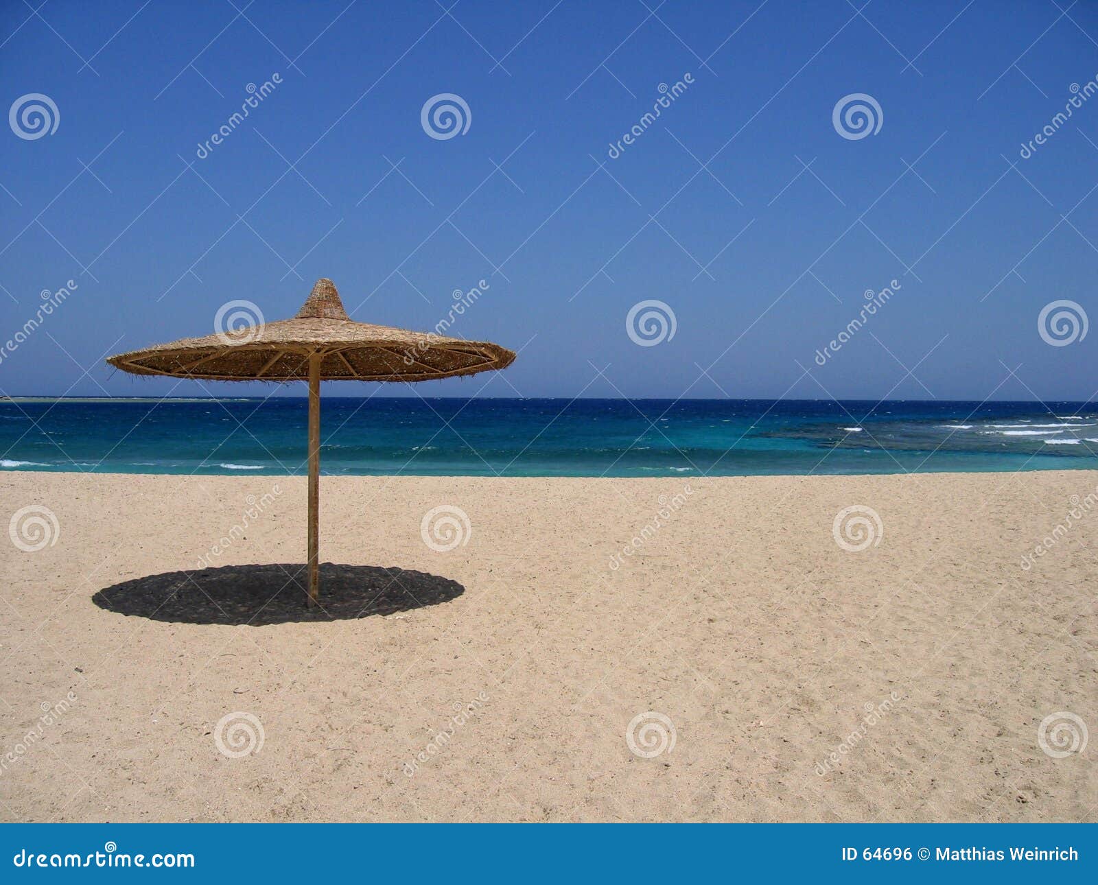 empty beach with sunshade