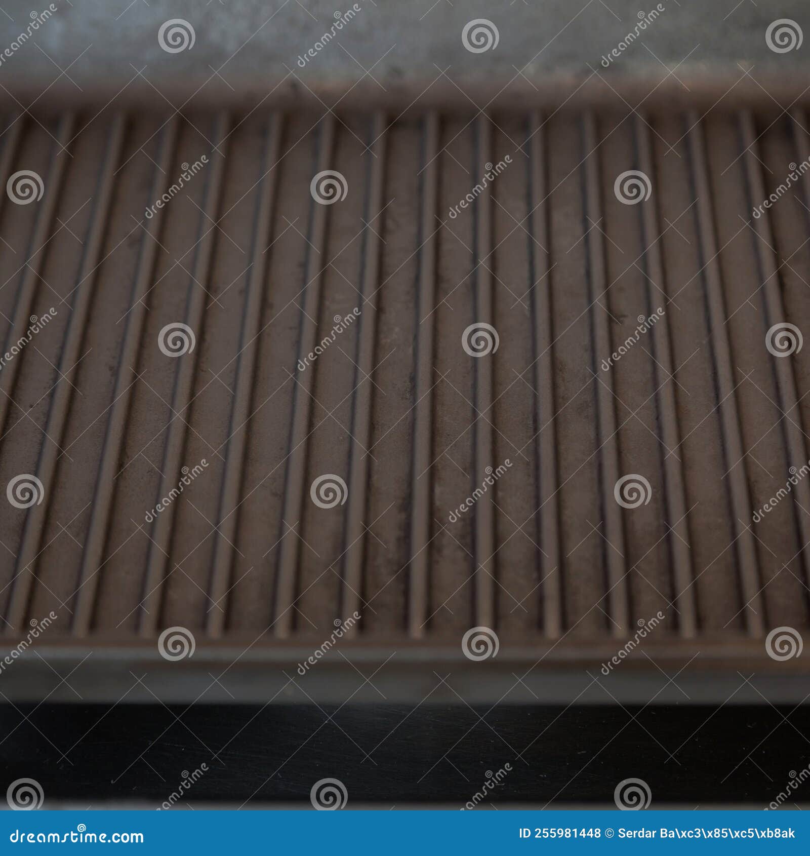 Empty Black Cast Iron Grill Pan on Gas Stove in a Modern Kitchen Stock