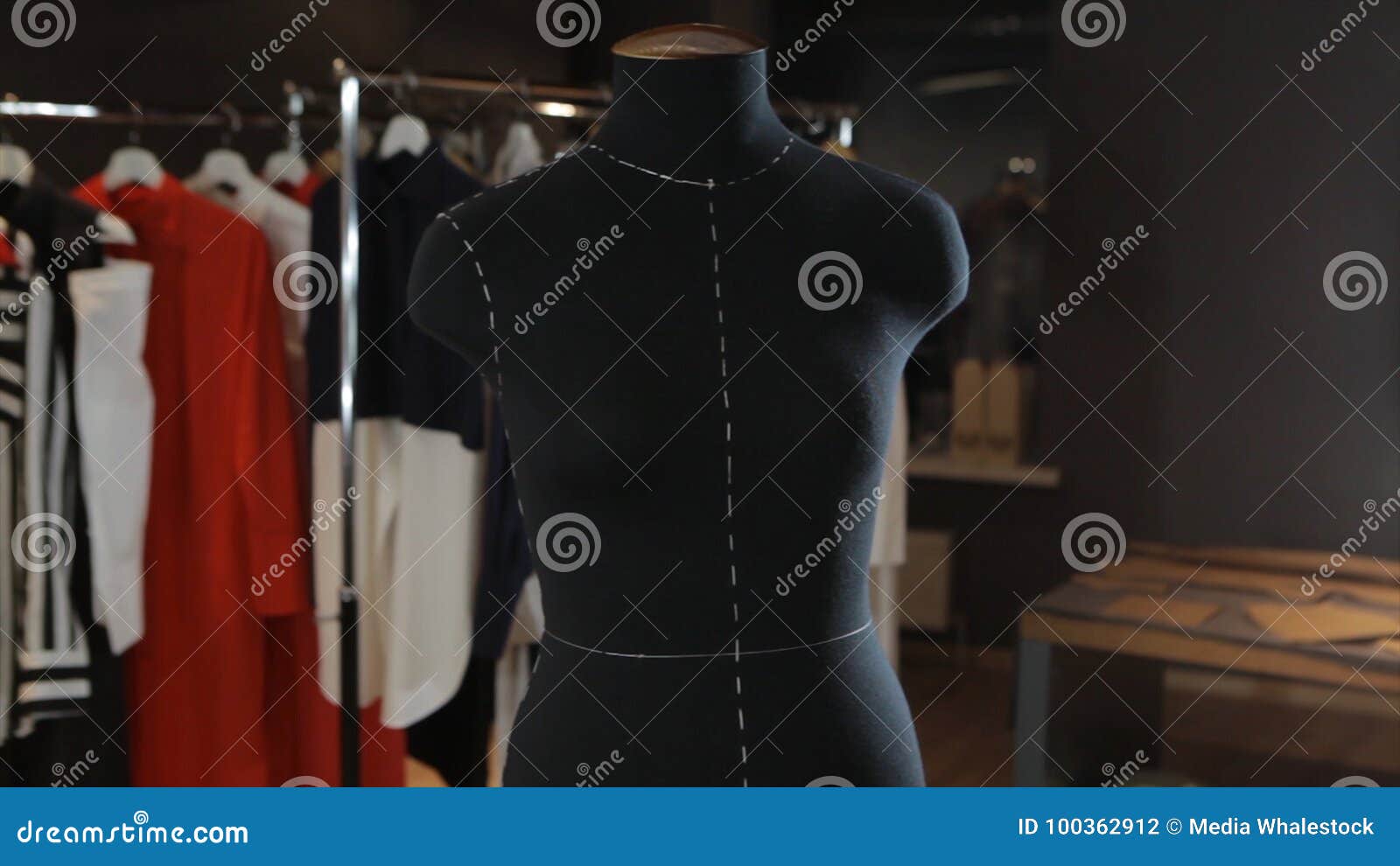 Empty Black Mannequin in the Background Light is in the Middle of the Studio. Cute Toy in the