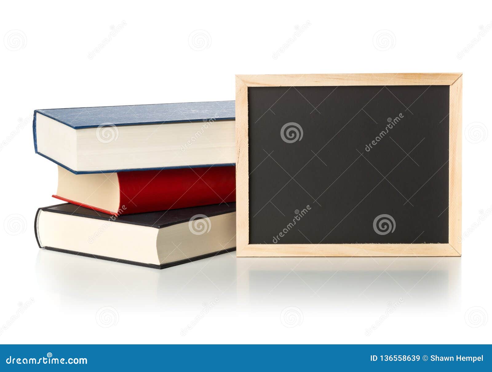 Empty, Blank, Black Chalkboard with Stack of Books Over White Stock