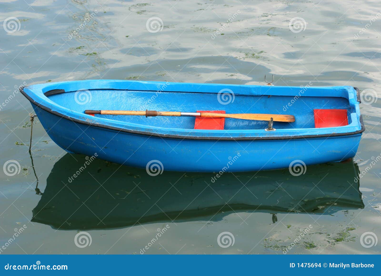 Empty Blue Rowing Boat stock photo. Image of reflection ...