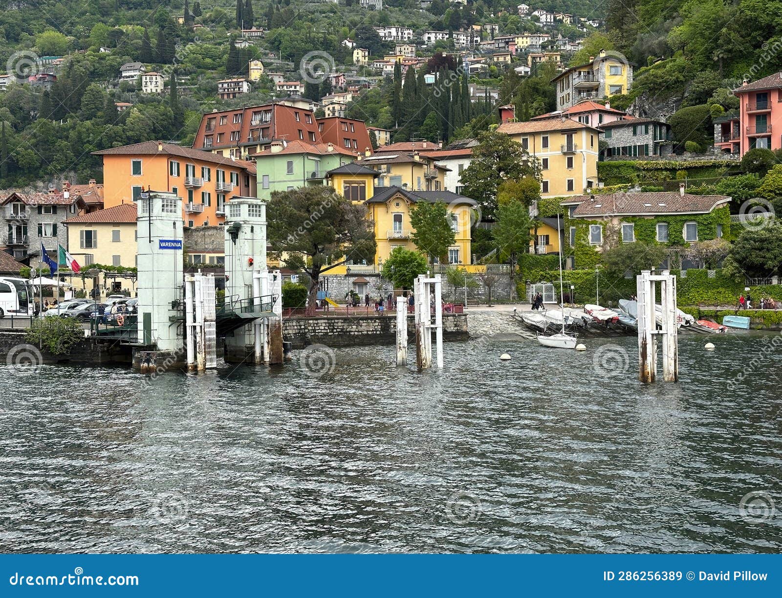 empty boat dock at varenna on lake como photographed from an approaching ferry of the navigazione laghi