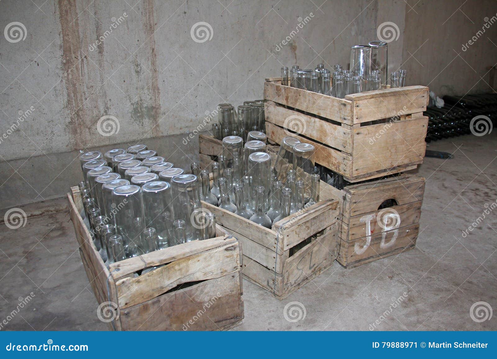 empty bottles in wooden boxes