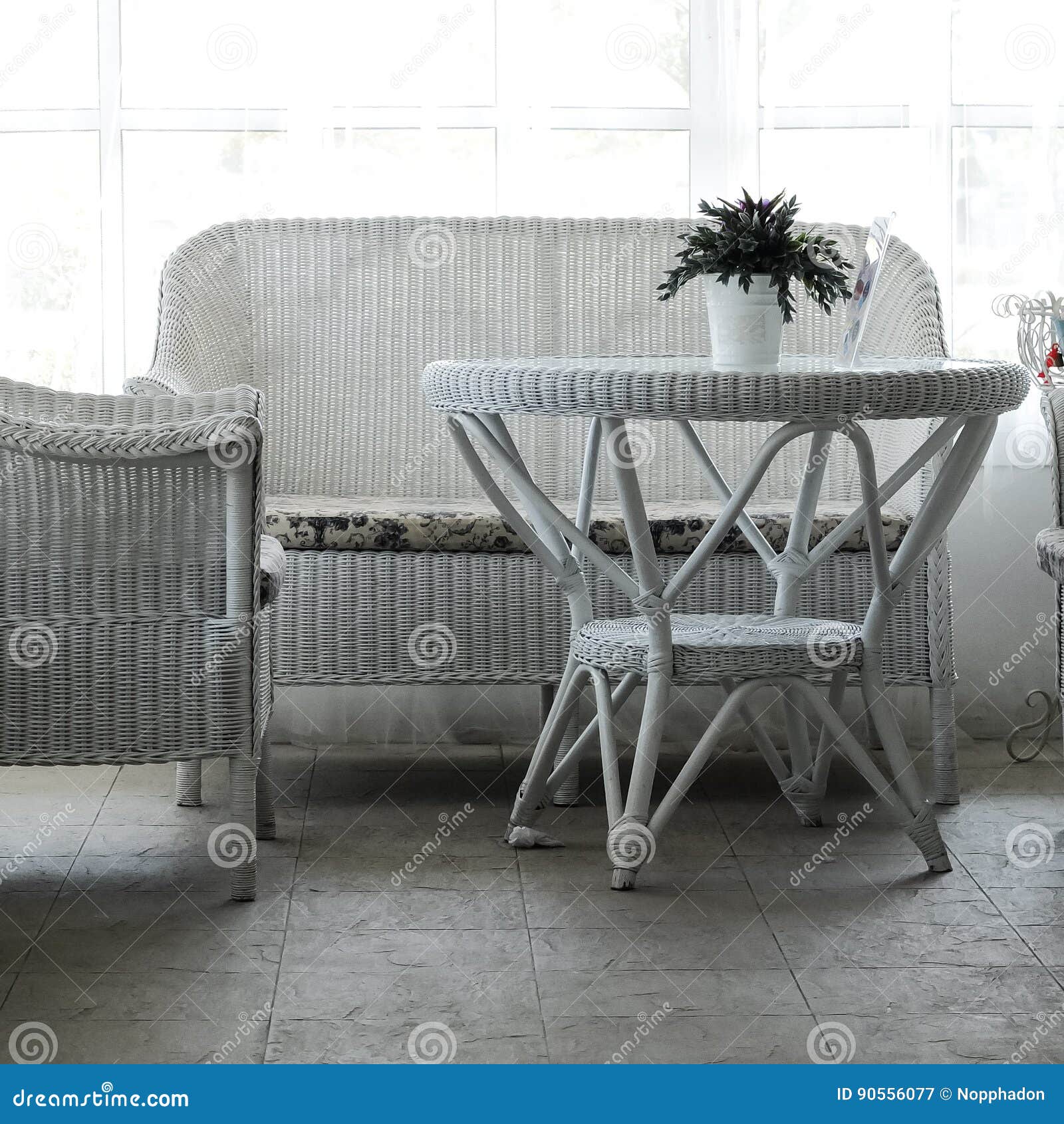 Empty Cafe Seating Area With Rattan Table And Chairs In Cottage