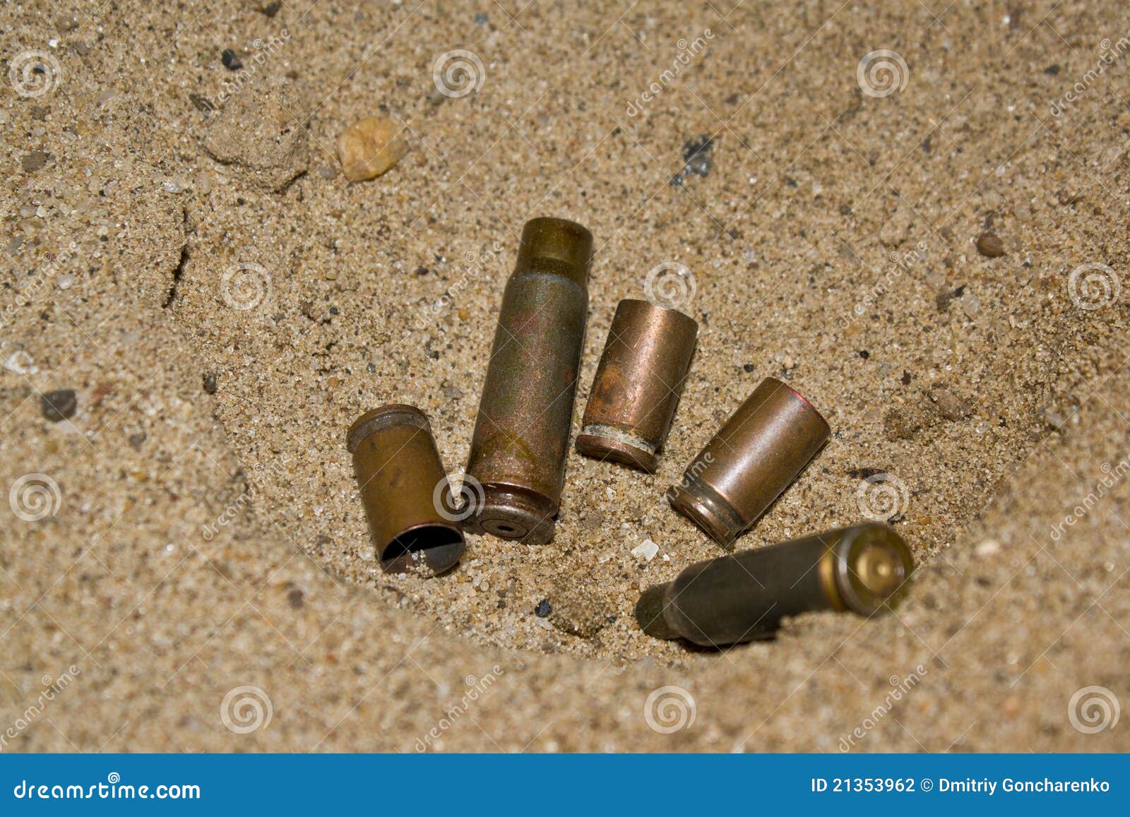 Empty cartridges on sand stock photo. Image of metal 21353962