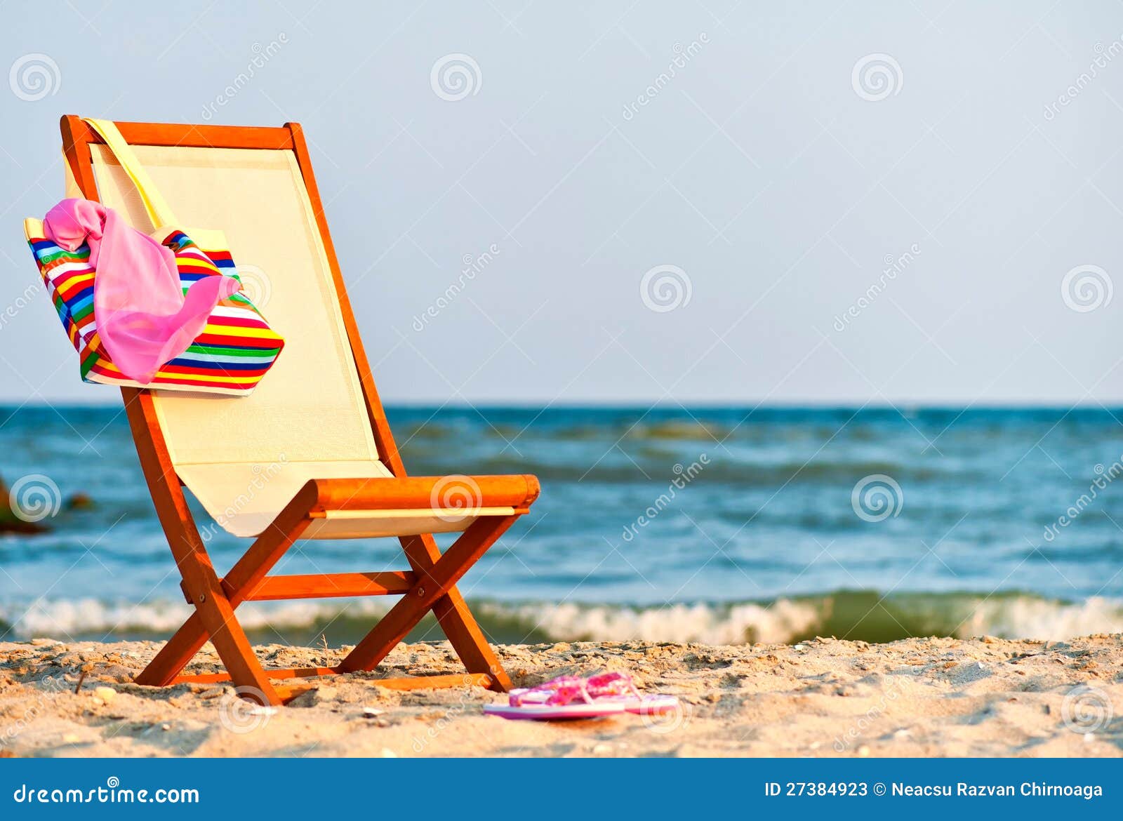Empty chair on the beach stock image. Image of lady, female 27384923