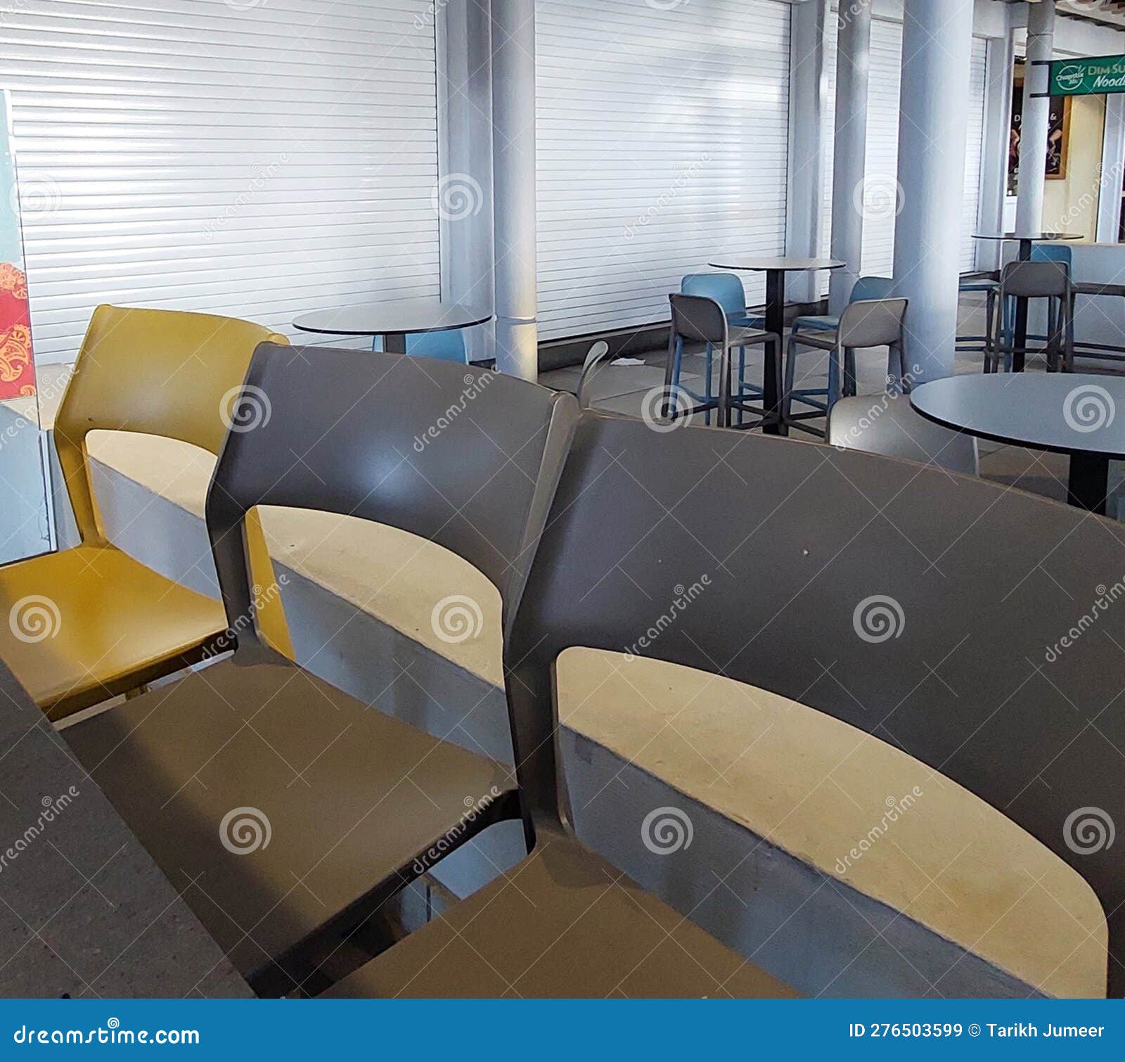 Empty Chairs and Tables at a Restaurant Closed Editorial Stock Image