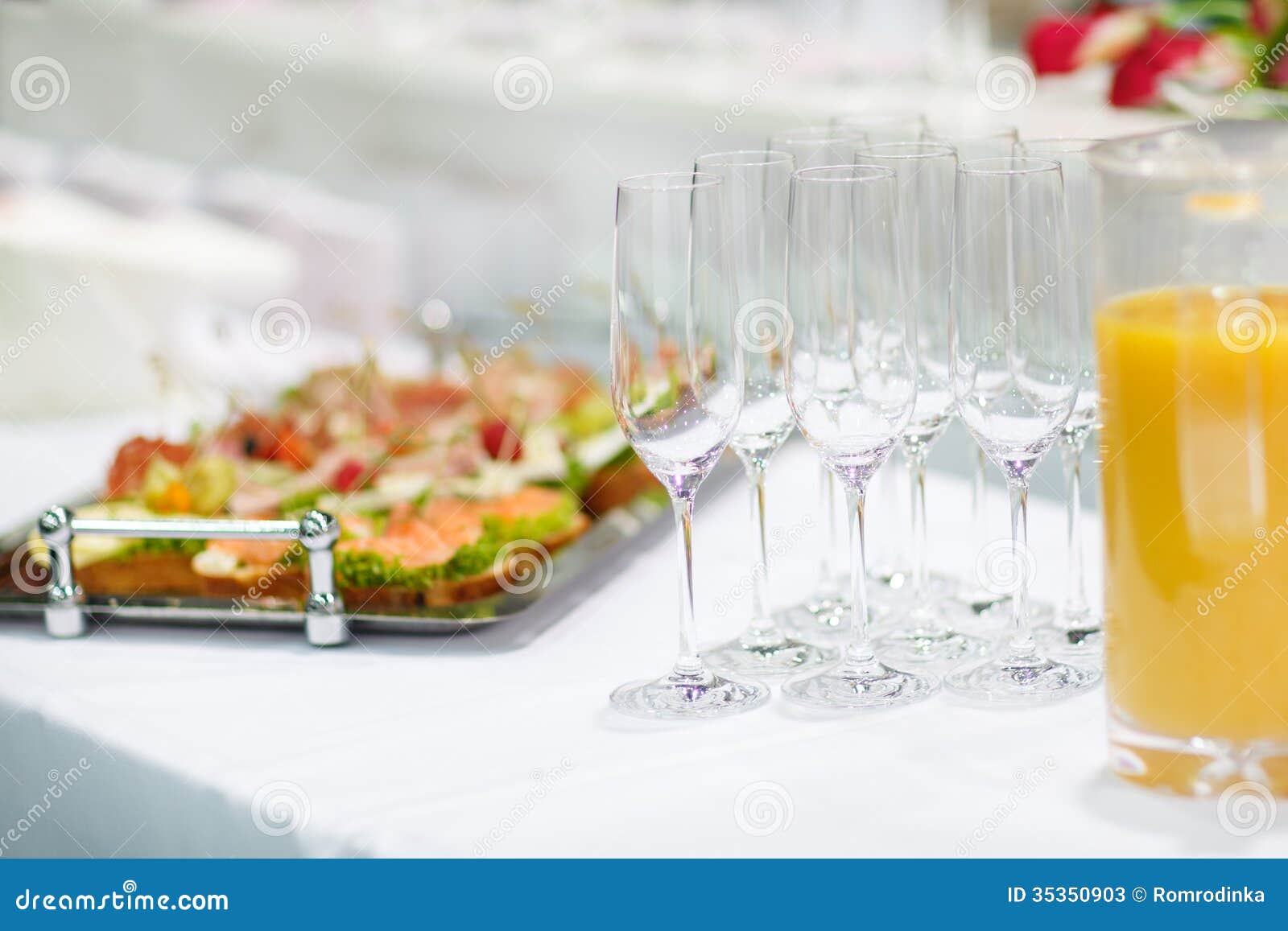 Empty Champagne Glasses and Finger Food on Festive Wedding Table Stock