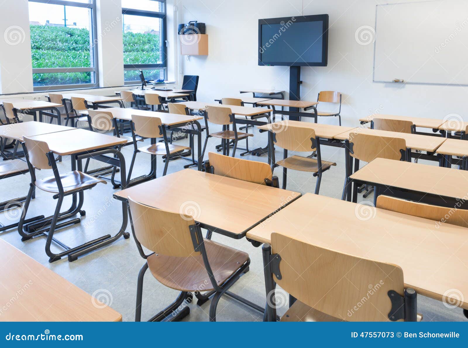 empty classroom with tables and chairs