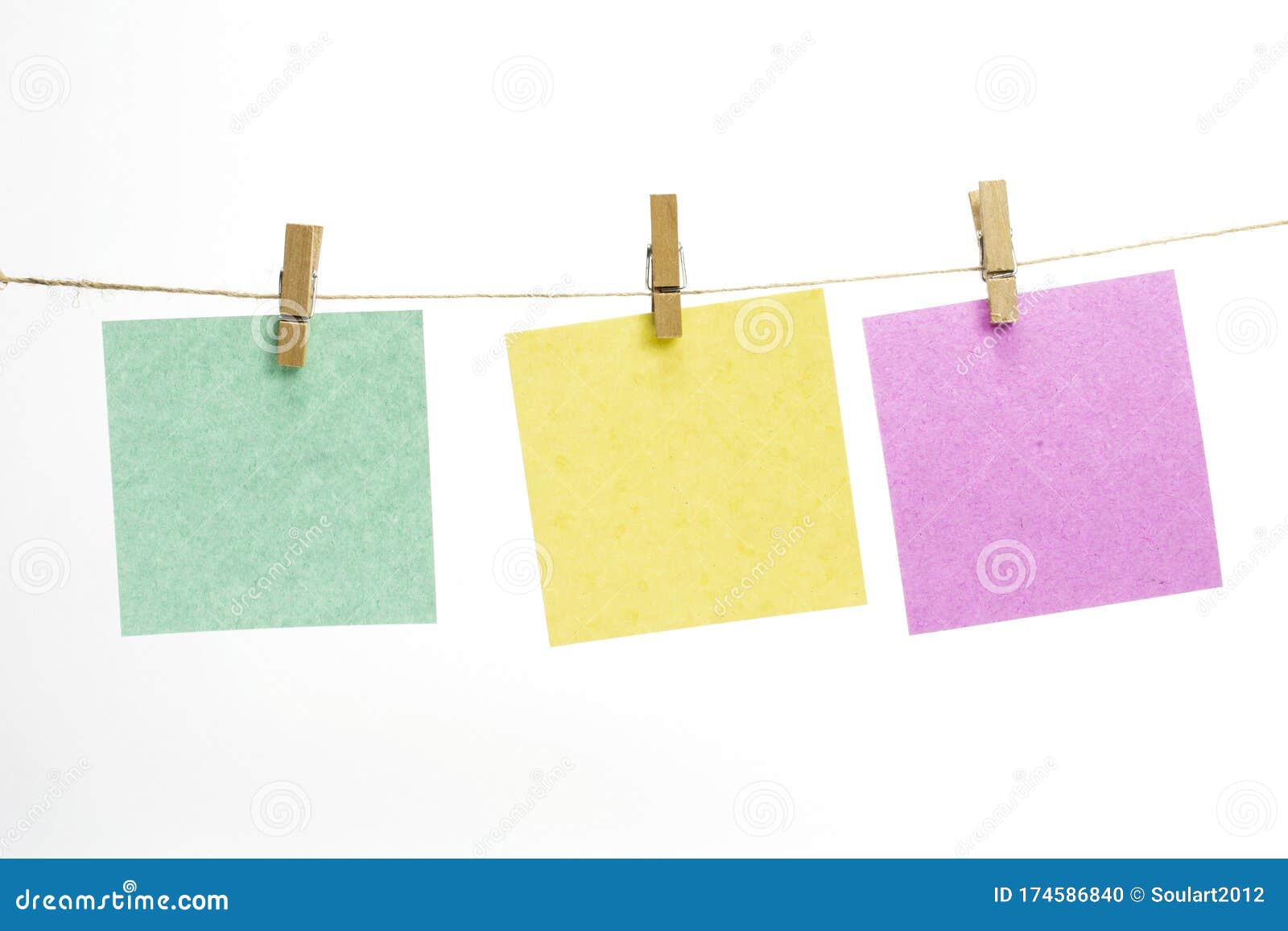 Concept image of tiny clothespins holding different color notes on