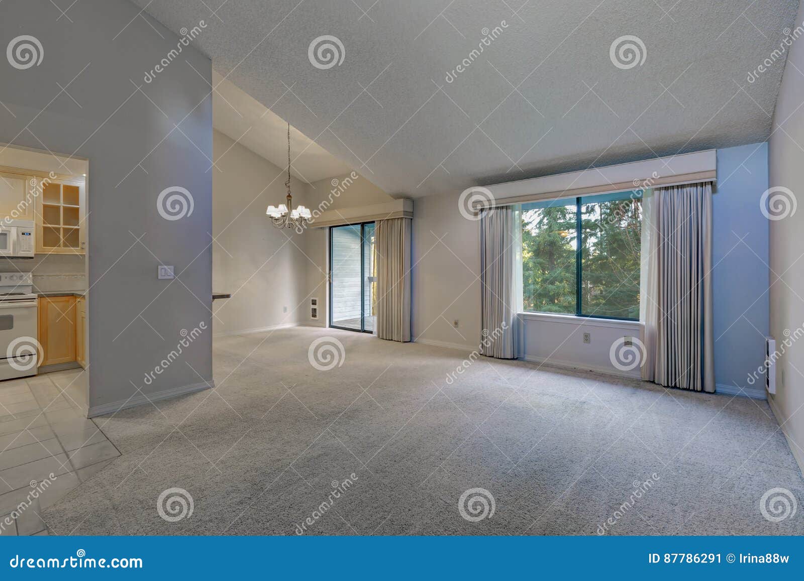 Empty Dining Space With Vaulted Ceiling And Grey Walls Stock Image
