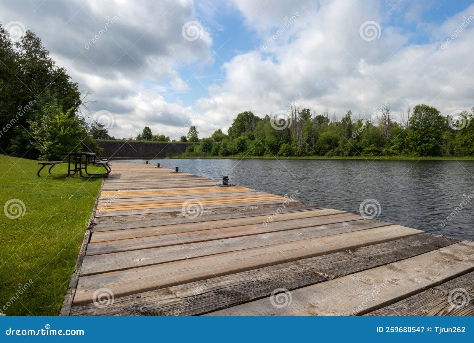 Empty Dock and Picnic Table beside a River Stock Image Image of