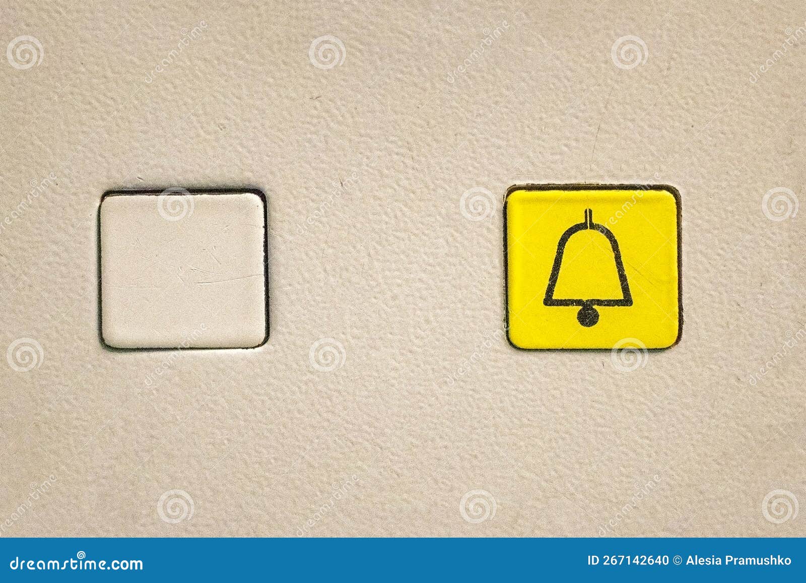 Empty Elevator Button and a Yellow One with a Bell Icon for Alarm Stock