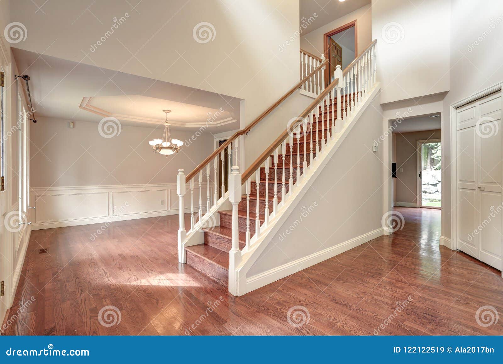 empty entrance room with staircase.