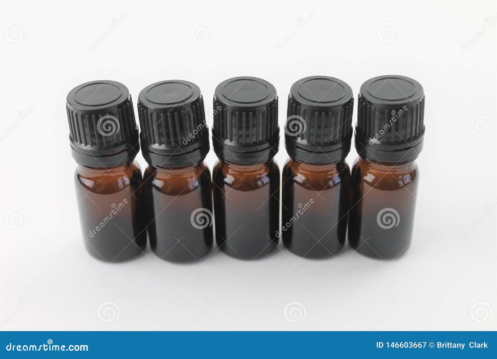 Empty Essential Oil Bottles on a White Background Isolated Stock Image
