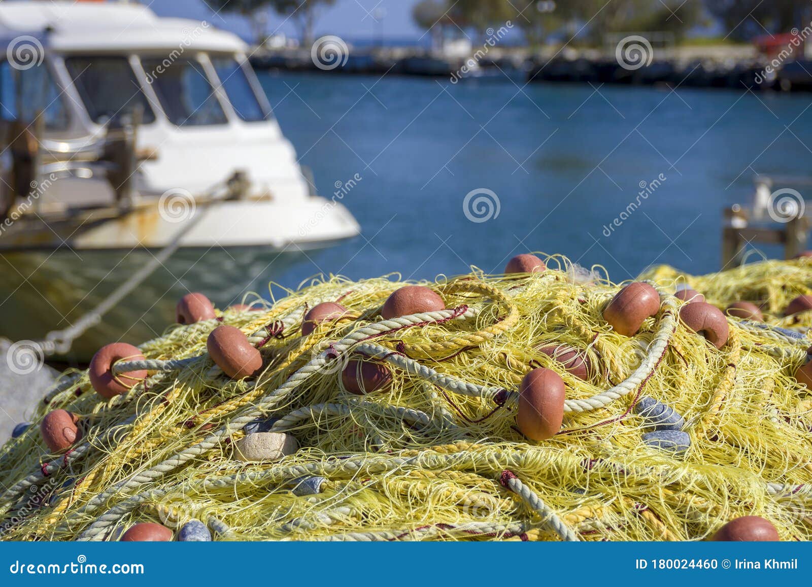 Empty Fishing Nets on Pier Near Parked Small Boat Stock Photo - Image of  marina, blue: 180024460