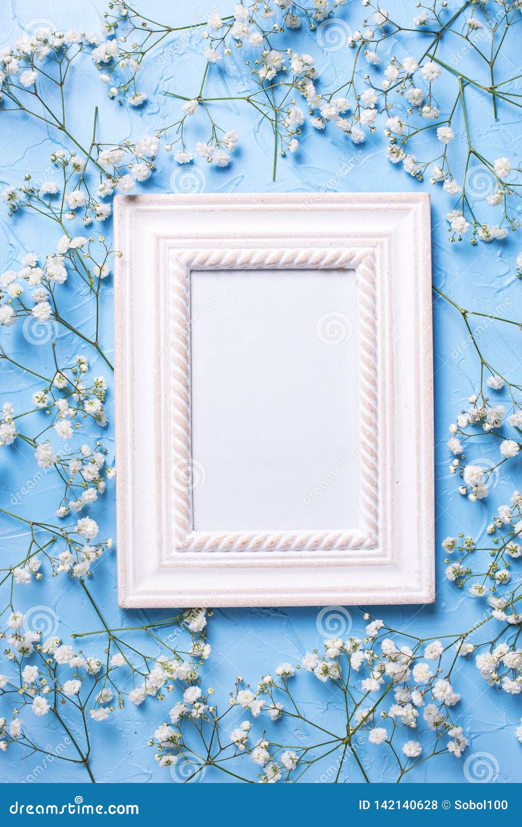 empty frame and fresh white gypsofila flowers