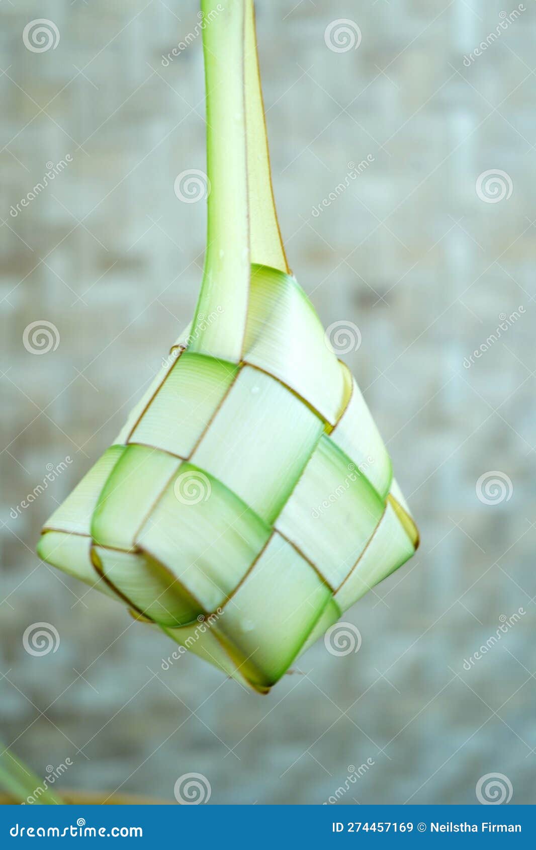 empty ketupat or empty woven palm leaf hung in a room. preparation for idul fitri or eid mubarak in indonesia