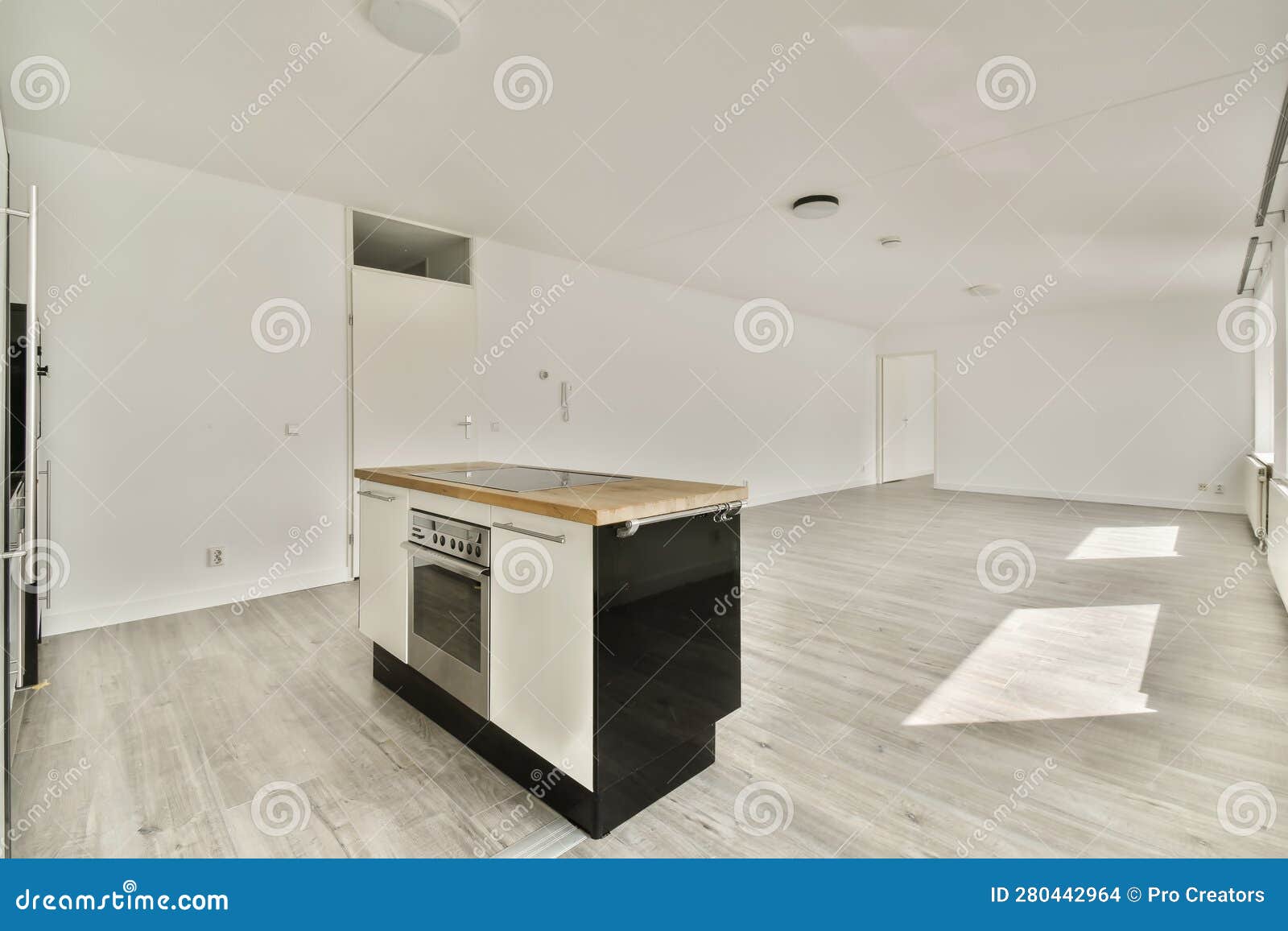 An Empty Kitchen with an Island in the Middle of Stock Photo Image of