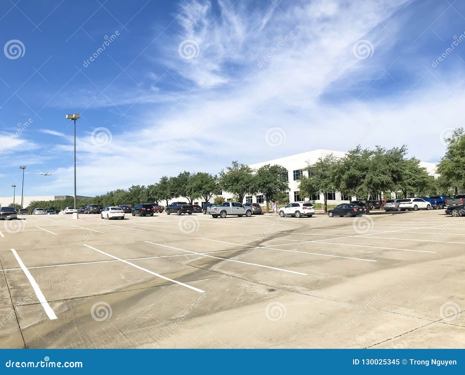 Huge Empty Urban Parking Lot On Cloud Blue Sky In Texas Usa Stock