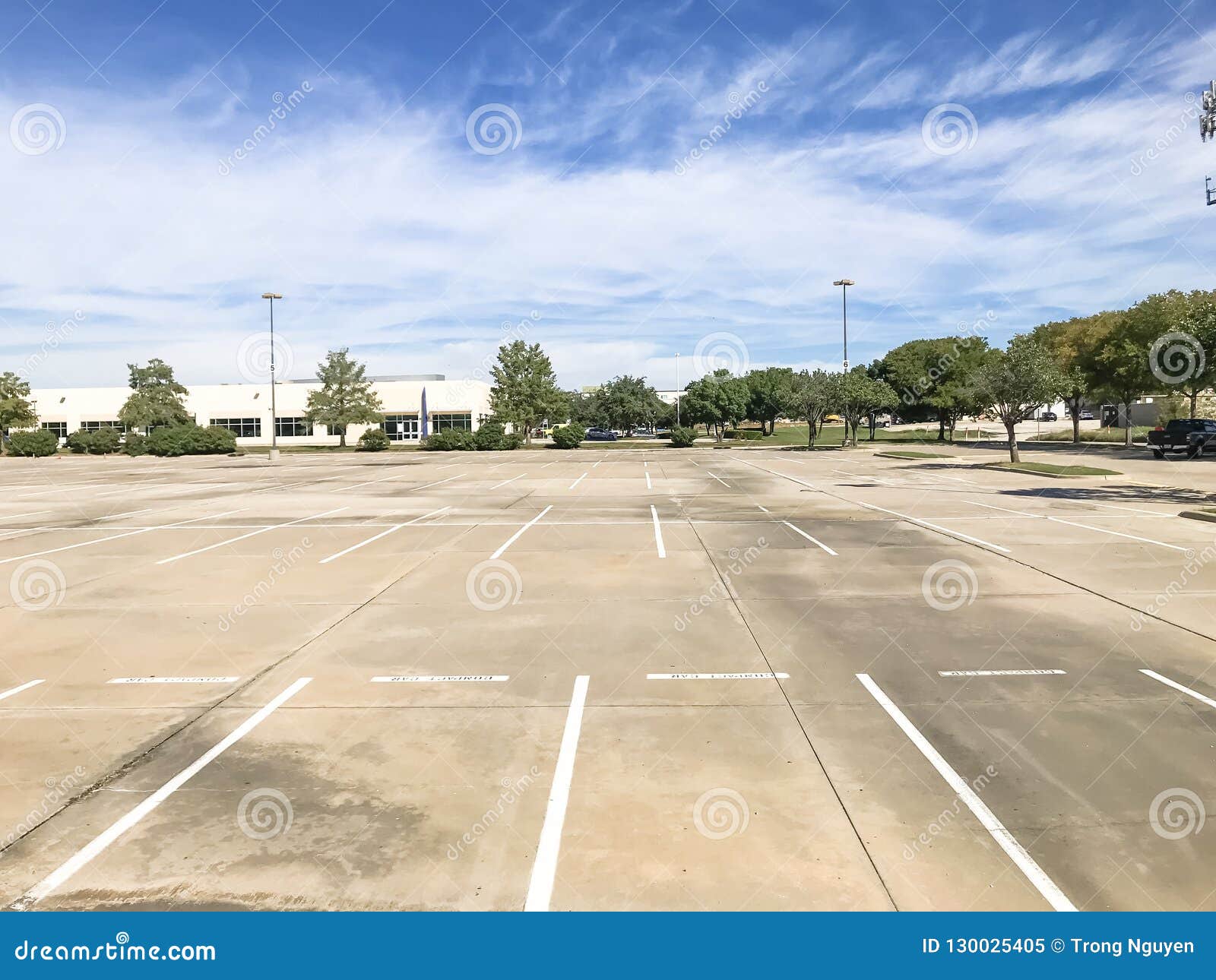 Huge Empty Urban Parking Lot On Cloud Blue Sky In Texas Usa Stock