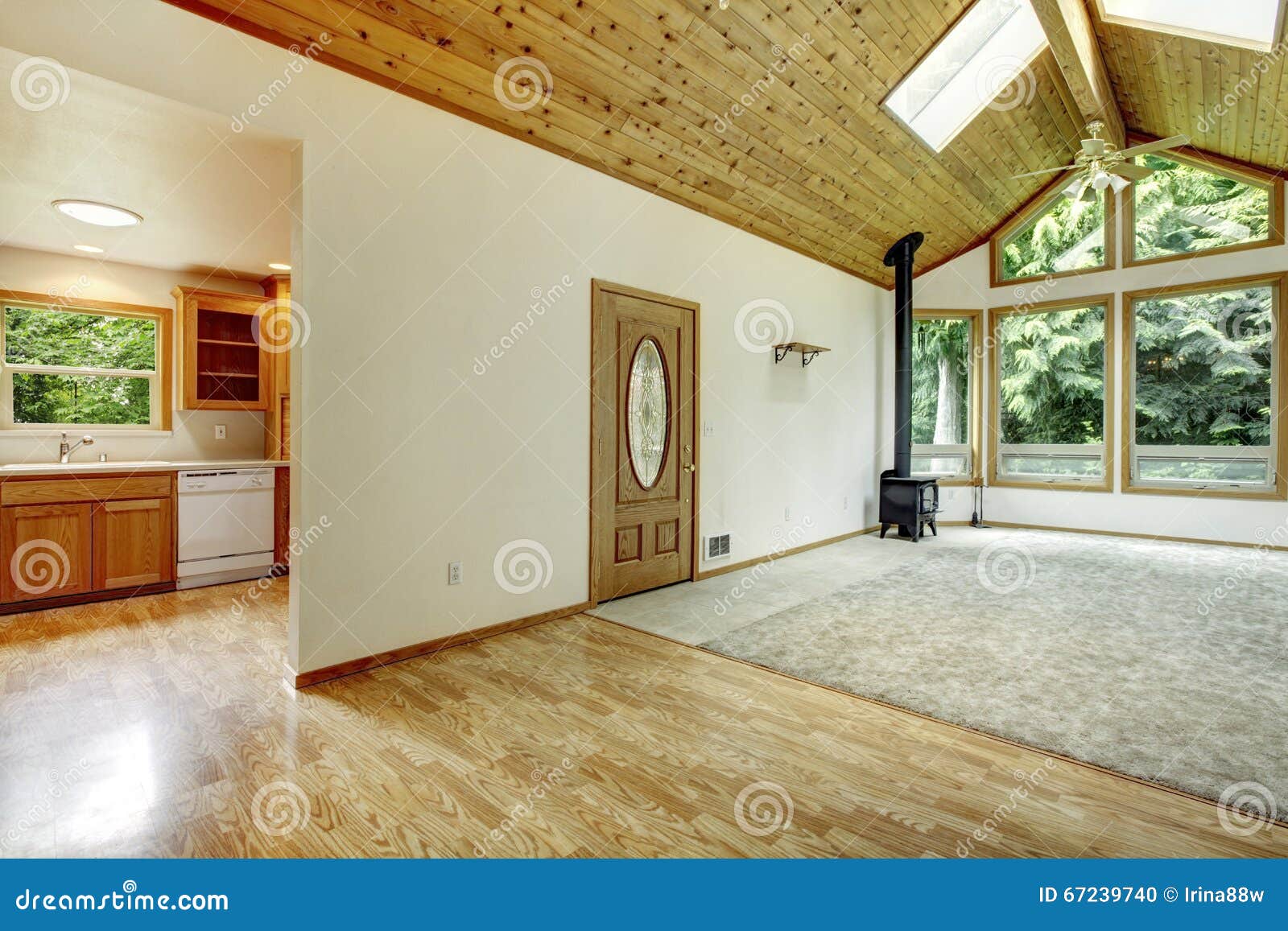 Empty Living Room With Connected Kitchen Vaulted Wood