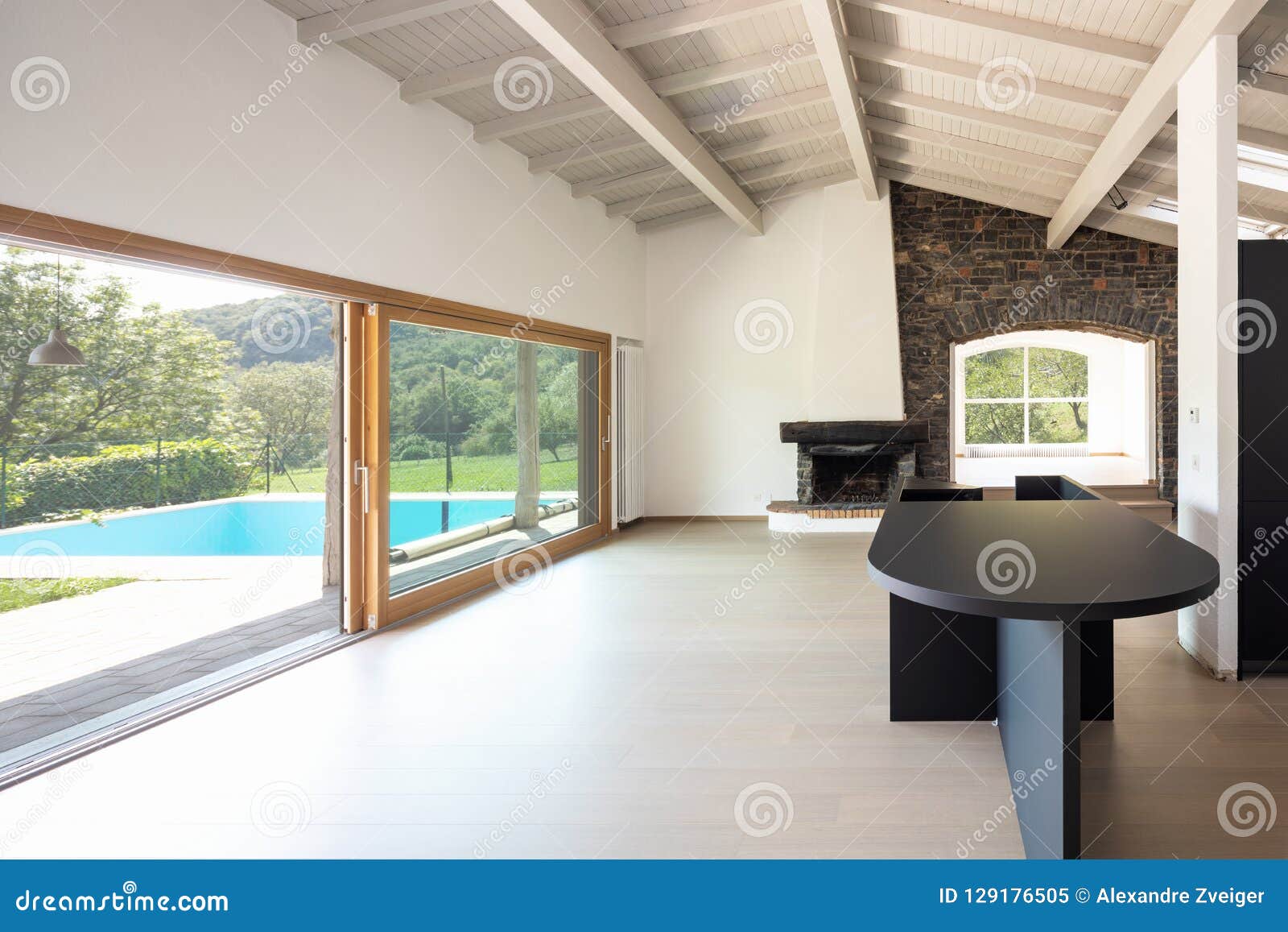 Empty Living Room With Dark Kitchen And Island Stock Image Image