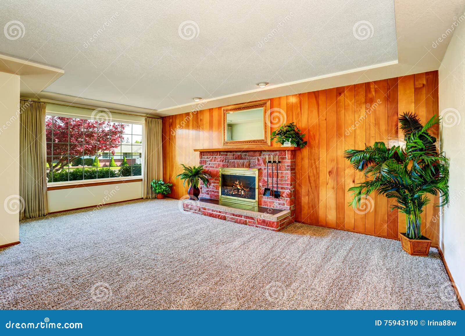 Empty Living Room With Wood Panel Wall And Fireplace Stock Photo