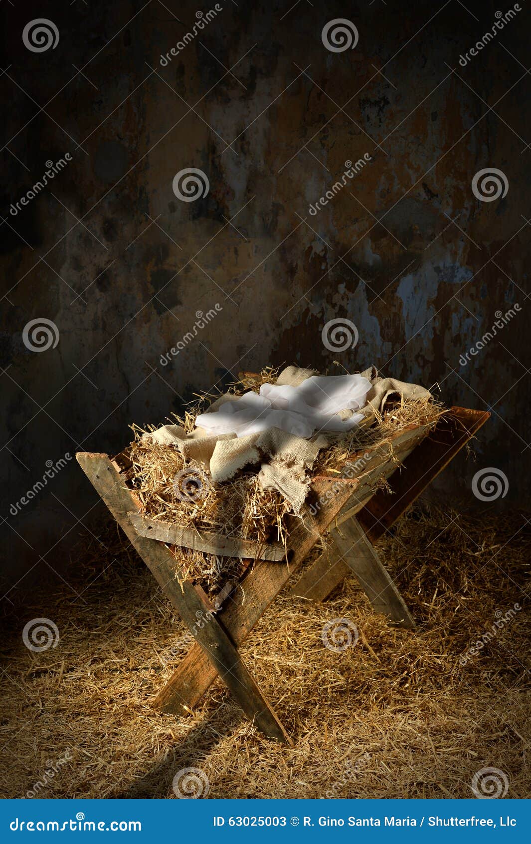 empty manger with cross shadow