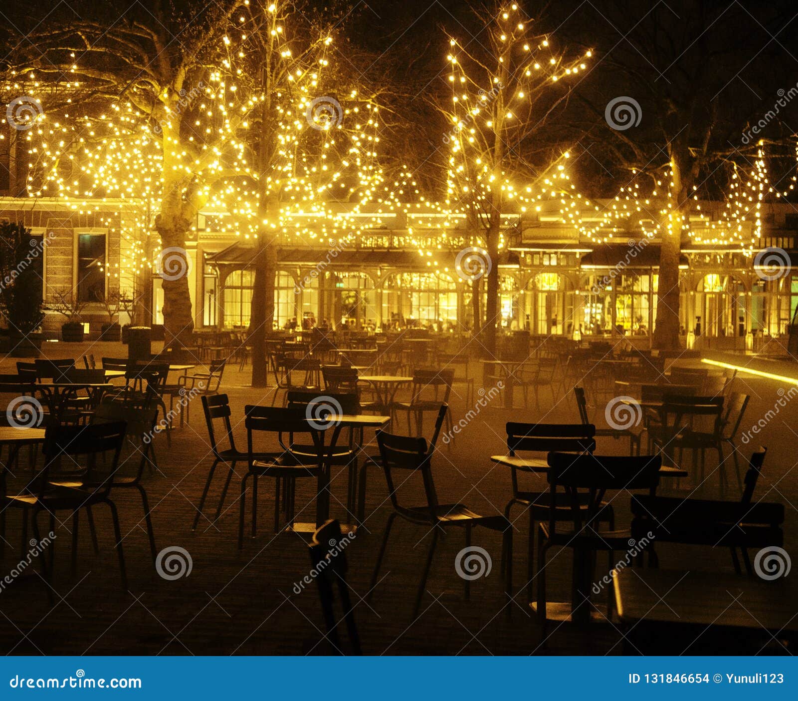 empty night restaurant, lot of tables and chairs with noone, mag