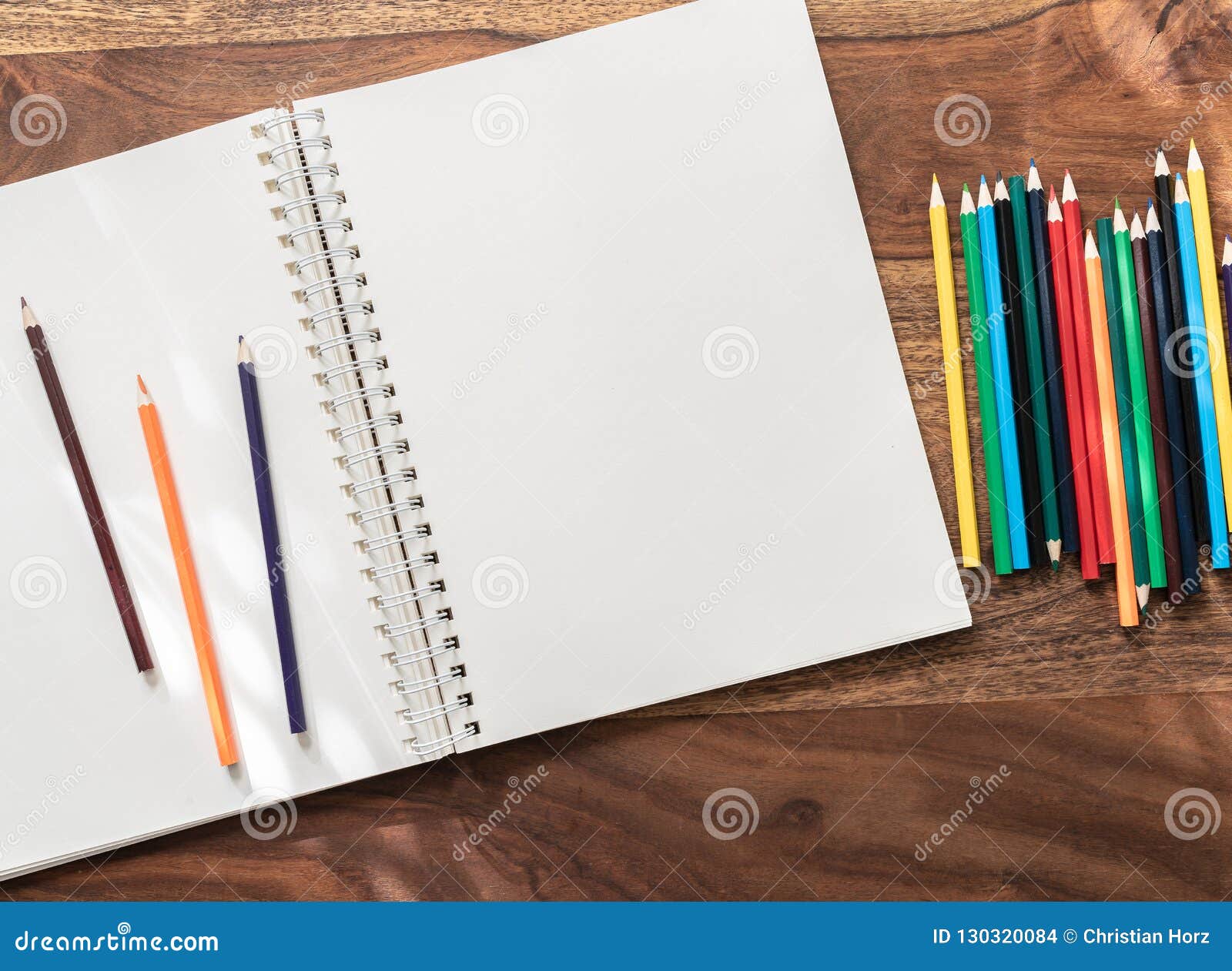 Opened notebook / sketchbook with one blank page paper and pencil - a  Royalty Free Stock Photo from Photocase